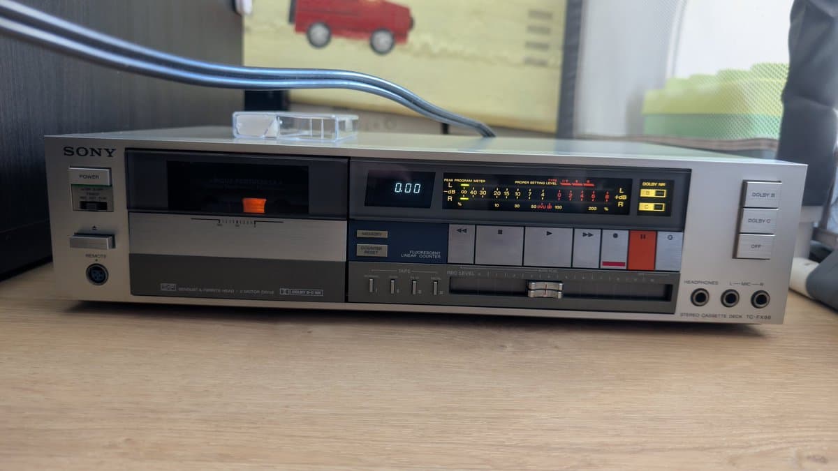 Sony TC-FX66 stereo cassette deck showing front panel with transport controls, level meters, and Dolby indicators in working condition.