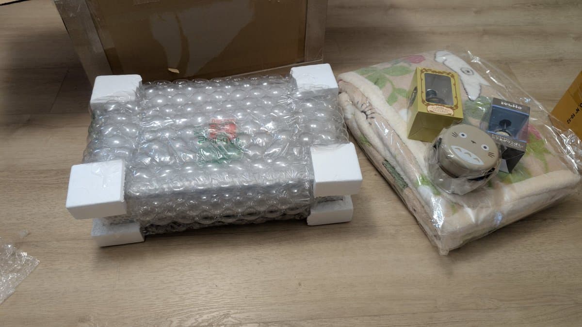 Sony TC-FX66 tape deck interior showing clean circuit board, capacitors, and mechanical components with white foam spacers for protection during storage.