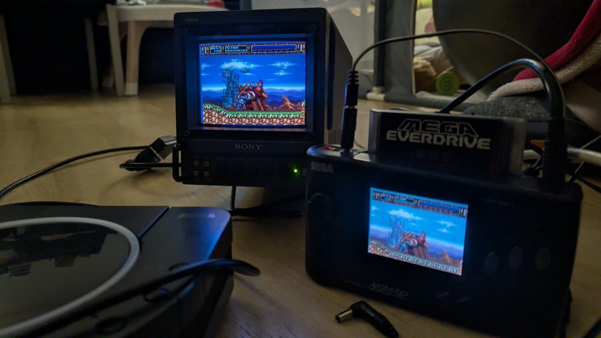 Sony PVM-6041Q displaying Rocket Knight Adventures via Sega Nomad RGB connection; Mega Everdrive visible; portable CRT restoration testing setup.