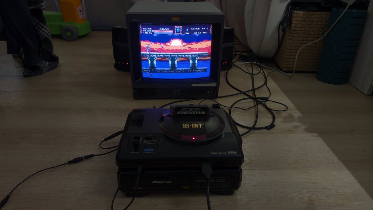 Sega Mega Drive connected to repaired Sony PVM-14M4J CRT displaying Castlevania Stage 2-1 with vibrant colors restored, showing successful repair completion.