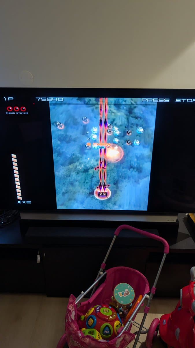 Galaga arcade game running on restored orange spice GameCube with FlippyDrive ODE, displayed on monitor during post-repair testing.